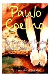 BY THE RIVER PIEDRA I SAT DOWN AND WEPT (English) (Paperback): Book by Paulo Coelho BY THE RIVER PIEDRA I SAT DOWN AND WEPT (English) (Paperback): Book by Paulo Coelho